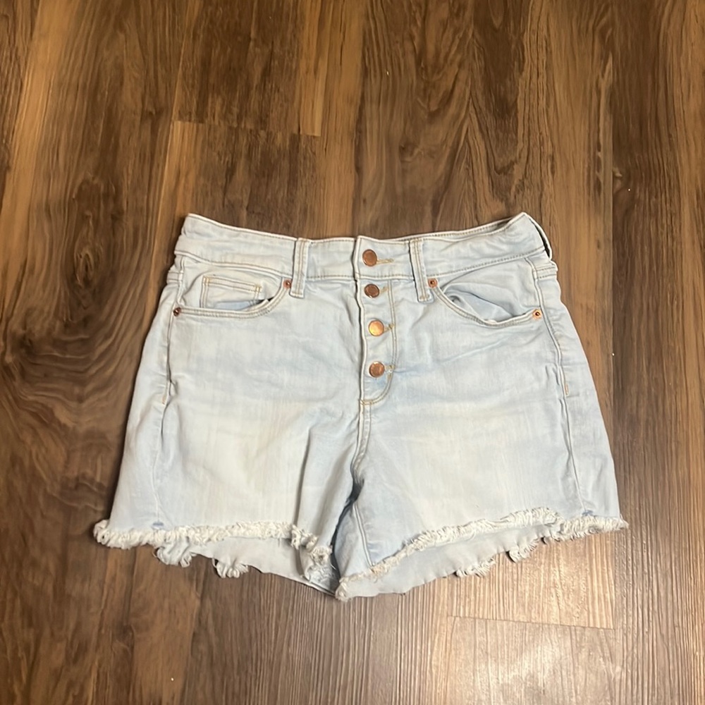 Light blue denim shorts with copper buttons